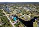 An aerial view showcasing the canal-front location of a property at 9300 Miami Cir, Port Charlotte, FL 33981