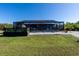 Screened lanai and patio area in the backyard at 9300 Miami Cir, Port Charlotte, FL 33981