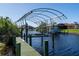 Covered boat dock with lift, perfect for boating enthusiasts at 9300 Miami Cir, Port Charlotte, FL 33981