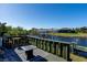 Waterfront deck with a fire pit, perfect for outdoor entertaining at 9300 Miami Cir, Port Charlotte, FL 33981