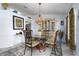 Dining room with glass-top table, decorative hutch, and tropical-themed accents at 9300 Miami Cir, Port Charlotte, FL 33981