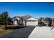 Charming Florida home with attached garage, carport, and lush landscaping at 9300 Miami Cir, Port Charlotte, FL 33981