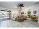 Living room with pool view, vaulted ceilings, and access to the backyard at 9300 Miami Cir, Port Charlotte, FL 33981