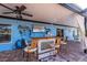 Relaxing outdoor space with bar, TV, and tropical decor at 9300 Miami Cir, Port Charlotte, FL 33981