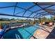 Screened-in pool and patio area with waterfront view at 9300 Miami Cir, Port Charlotte, FL 33981