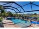 Screened-in pool with a tranquil waterfront view at 9300 Miami Cir, Port Charlotte, FL 33981