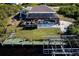 Private pool area with screened enclosure, boat dock, and lush landscaping at 9300 Miami Cir, Port Charlotte, FL 33981