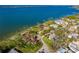 Aerial view of waterfront home and surrounding neighborhood at 99 W Riverview Ave, Englewood, FL 34223