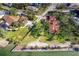 Overhead view of property highlighting its waterfront position and landscaping at 99 W Riverview Ave, Englewood, FL 34223