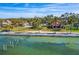 Aerial view of waterfront home with large yard and private dock at 99 W Riverview Ave, Englewood, FL 34223