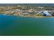 Wide aerial view of waterfront home and neighborhood at 99 W Riverview Ave, Englewood, FL 34223