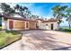 Spacious garage with ample storage space and decorative accents at 99 W Riverview Ave, Englewood, FL 34223
