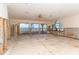 Large living room with water views and damage from flooding at 99 W Riverview Ave, Englewood, FL 34223