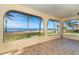 Bright sunroom with amazing waterfront views at 99 W Riverview Ave, Englewood, FL 34223