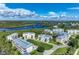Waterfront community with multiple buildings and lush landscaping at 10300 Coral Landings Ct # 91, Placida, FL 33946