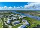 Waterfront community with multiple buildings and lush landscaping at 10300 Coral Landings Ct # 91, Placida, FL 33946
