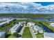 Waterfront community with multiple buildings and lush landscaping at 10300 Coral Landings Ct # 91, Placida, FL 33946