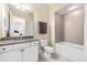 Bathroom with granite countertop, toilet and bathtub at 10300 Coral Landings Ct # 91, Placida, FL 33946