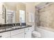 Small bathroom with granite countertop, toilet, and bathtub at 10300 Coral Landings Ct # 91, Placida, FL 33946