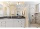 Double vanity bathroom with granite countertop and walk-in shower at 10300 Coral Landings Ct # 91, Placida, FL 33946