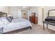 Bright bedroom with king-size bed, dresser, and en-suite bathroom at 10300 Coral Landings Ct # 91, Placida, FL 33946
