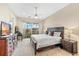 Main bedroom with king-size bed, dresser, and access to balcony at 10300 Coral Landings Ct # 91, Placida, FL 33946