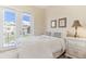 Bedroom with a queen bed and private balcony access at 10300 Coral Landings Ct # 91, Placida, FL 33946