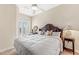 King size bed in a bright bedroom with private balcony at 10300 Coral Landings Ct # 91, Placida, FL 33946