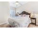 Spacious bedroom with king-size bed, access to balcony and lots of natural light at 10300 Coral Landings Ct # 91, Placida, FL 33946