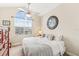 King bedroom with large window and ceiling fan at 10300 Coral Landings Ct # 91, Placida, FL 33946