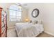 King bedroom with large window, ceiling fan, and dresser at 10300 Coral Landings Ct # 91, Placida, FL 33946