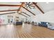 Spacious clubhouse featuring high ceilings, exposed beams, a stone fireplace, and stylish seating areas at 10300 Coral Landings Ct # 91, Placida, FL 33946