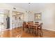 Bright dining area with wooden table and chairs, and kitchen access at 10300 Coral Landings Ct # 91, Placida, FL 33946