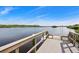 Wooden dock with steps leading down to the water at 10300 Coral Landings Ct # 91, Placida, FL 33946