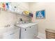 Laundry room with washer, dryer, shelving and utility sink at 10300 Coral Landings Ct # 91, Placida, FL 33946