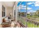 Relaxing screened porch with seating area and view of community at 10300 Coral Landings Ct # 91, Placida, FL 33946