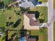 Top-down aerial perspective of the home's roof and surrounding yard at 1437 Keyway Rd, Englewood, FL 34223