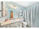 Clean bathroom with a shower/tub combo and updated vanity at 1740 Faust Dr, Englewood, FL 34224