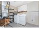 Laundry area with washer, dryer, and shelving at 18380 Ohara Dr, Port Charlotte, FL 33948