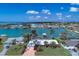 Aerial view of waterfront home with lush landscaping at 1940 Mississippi Ave, Englewood, FL 34224