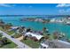 Aerial view of waterfront home and canal at 1940 Mississippi Ave, Englewood, FL 34224
