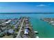 Wide aerial showcasing waterfront home and canal at 1940 Mississippi Ave, Englewood, FL 34224