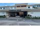 Cambridge House condo building, featuring parking and a courtyard at 21260 Brinson Ave # 103, Port Charlotte, FL 33952