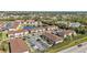 Aerial view of community near a pond and road at 25100 Sandhill Blvd # B-103, Punta Gorda, FL 33983