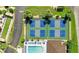 Aerial view of community amenities including pool, pickleball, and bocce ball courts at 25100 Sandhill Blvd # B-103, Punta Gorda, FL 33983