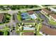 Aerial view showing community pool, pickleball, and bocce ball at 25100 Sandhill Blvd # B-103, Punta Gorda, FL 33983