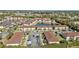 Aerial view of community showing building and pond at 25100 Sandhill Blvd # B-103, Punta Gorda, FL 33983