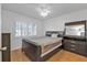 Spacious bedroom with wood floors and large window at 25100 Sandhill Blvd # B-103, Punta Gorda, FL 33983