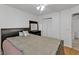 Bright bedroom with mirrored furniture and wood floors at 25100 Sandhill Blvd # B-103, Punta Gorda, FL 33983