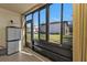 Enclosed patio with view of neighboring building at 25100 Sandhill Blvd # B-103, Punta Gorda, FL 33983